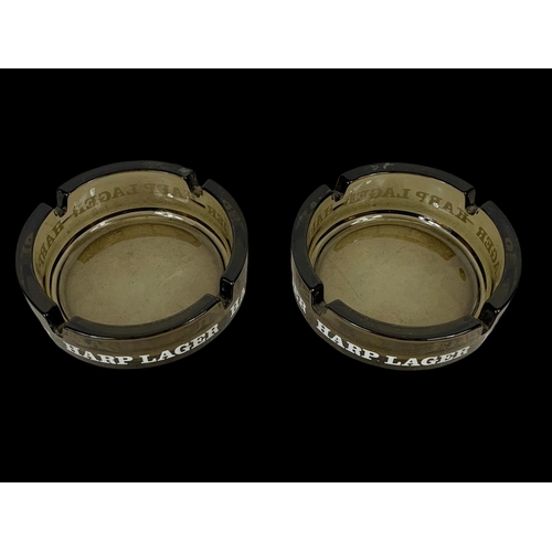 518 - A pair of Harp glass ashtrays. 10.5cm.