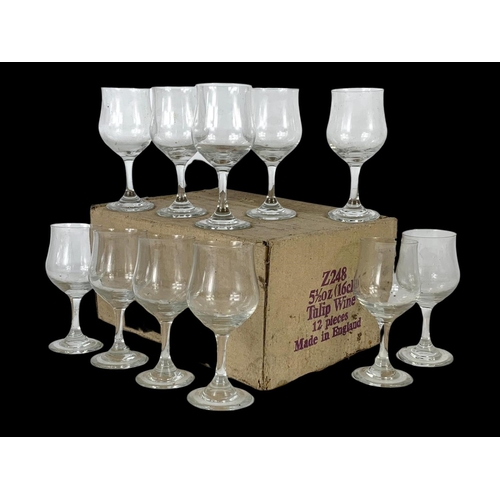 539 - A set of 12 vintage tulip wine glasses in box.