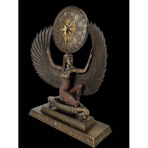 561 - A large Egyptian style clock. 33 x 44cm.