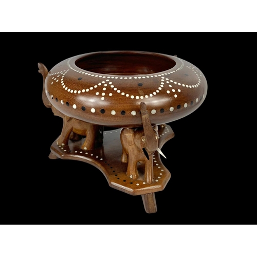 64 - An inlaid Indian hardwood centrepiece bowl on stand with elegant decoration. 21 x 15cm.