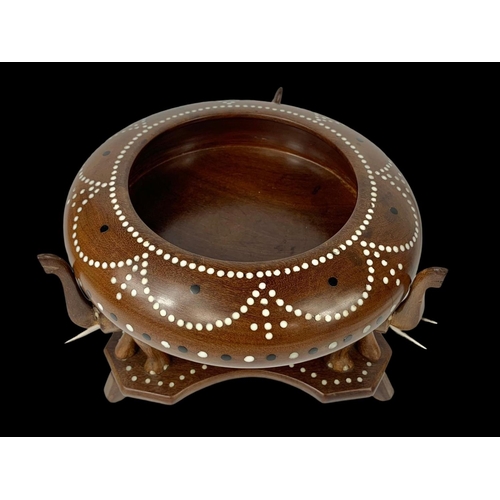 64 - An inlaid Indian hardwood centrepiece bowl on stand with elegant decoration. 21 x 15cm.