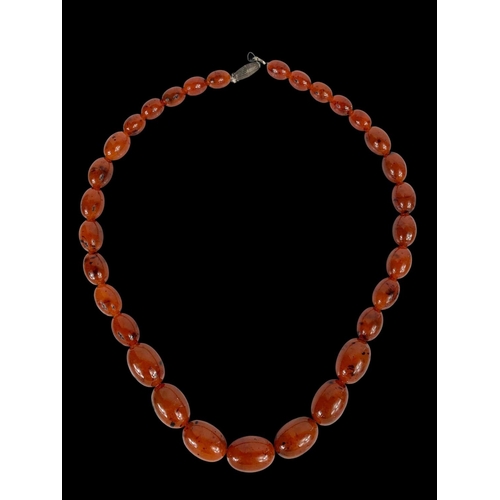 659 - A large vintage Amber style necklace.