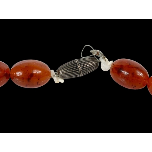 659 - A large vintage Amber style necklace.