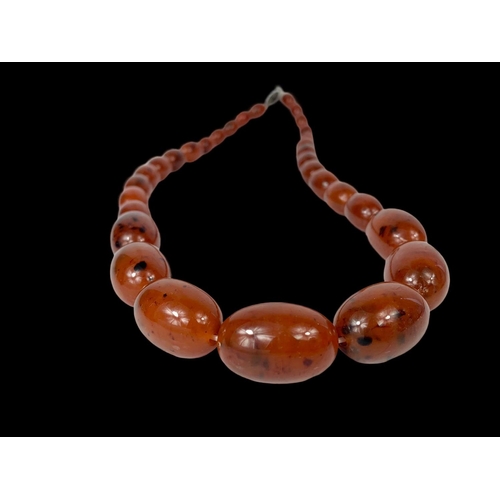 659 - A large vintage Amber style necklace.