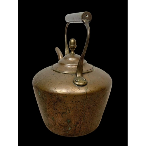 68 - A large Victorian copper kettle. 36 x 34cm.