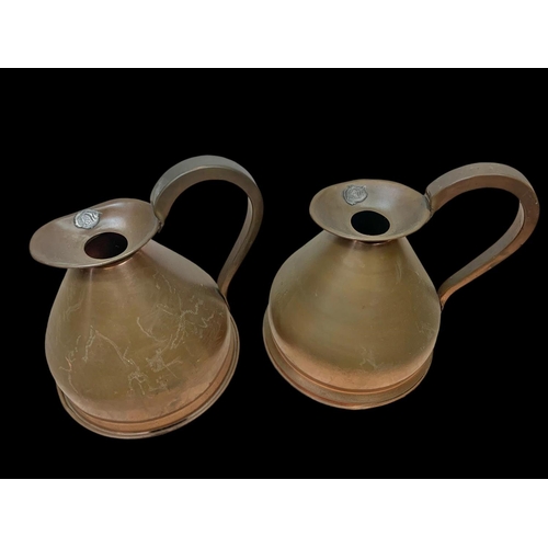 69 - A set of 3 Victorian copper jugs. 25 x 25cm.