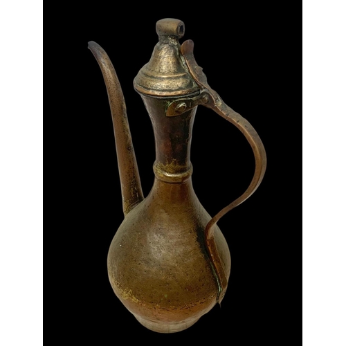 70 - 3 large early 20th century Middle Eastern copper pitchers largest 41cm