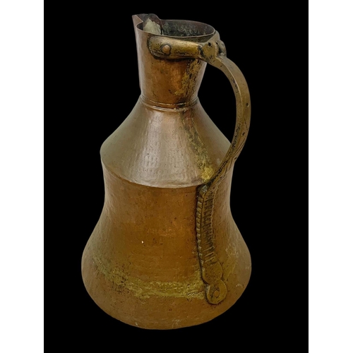 70 - 3 large early 20th century Middle Eastern copper pitchers largest 41cm