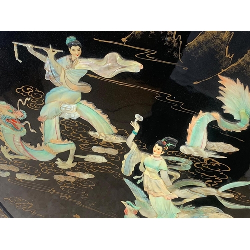 71 - A large vintage oriental lacquered wall plaque. 89.5cm.