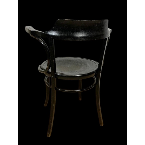 782 - A vintage bentwood armchair.