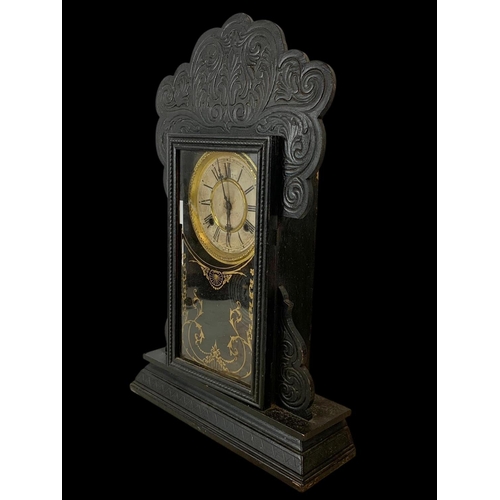80 - A 19th century American Gingerbread clock. 37 x 56.5cm.