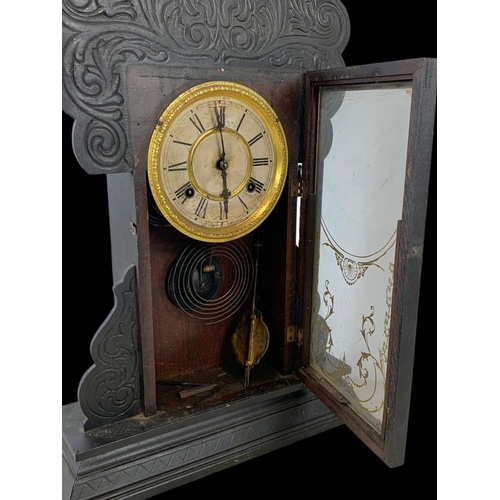 80 - A 19th century American Gingerbread clock. 37 x 56.5cm.