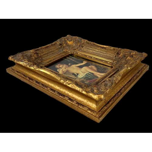 81 - An ornate gilt framed print. Carvers & Gilders Picture Makers & Restorers. 39.5 x 7 x 45cm