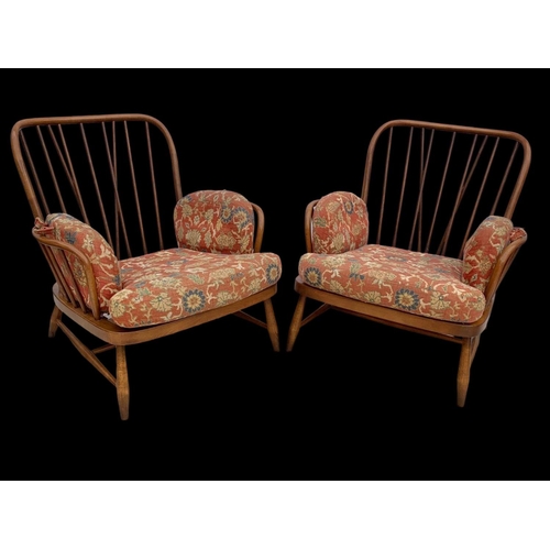 820 - A pair of Ercol Golden Dawn Windsor “Jubilee” armchairs. Mid century. Circa 1960’s. 81 x 94 x 83cm.