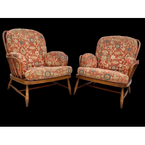 820 - A pair of Ercol Golden Dawn Windsor “Jubilee” armchairs. Mid century. Circa 1960’s. 81 x 94 x 83cm.