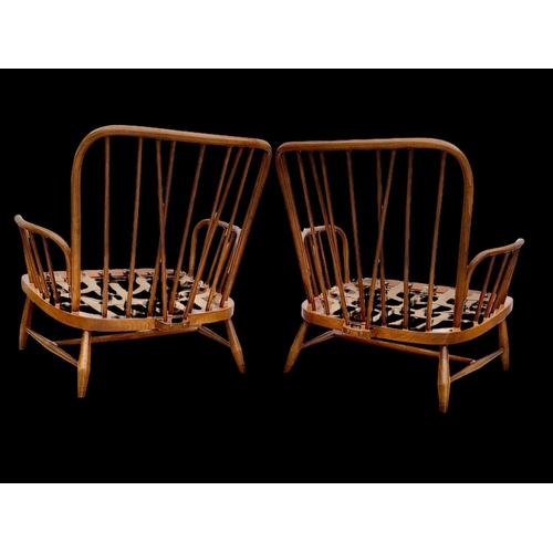 820 - A pair of Ercol Golden Dawn Windsor “Jubilee” armchairs. Mid century. Circa 1960’s. 81 x 94 x 83cm.