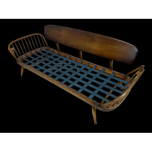 822 - An Ercol Elm Model 355 Studio Daybed. Mid century. Circa 1960. 211cm.