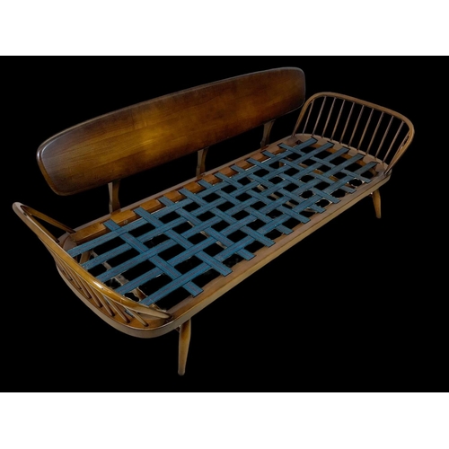 822 - An Ercol Elm Model 355 Studio Daybed. Mid century. Circa 1960. 211cm.