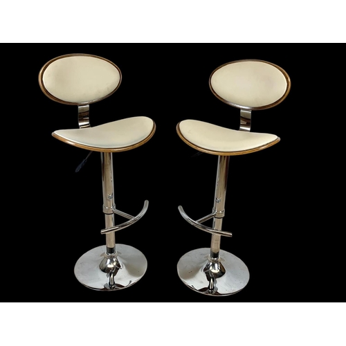 824 - A pair of Charles Eames style high stools. Ground to back 113.5cm.