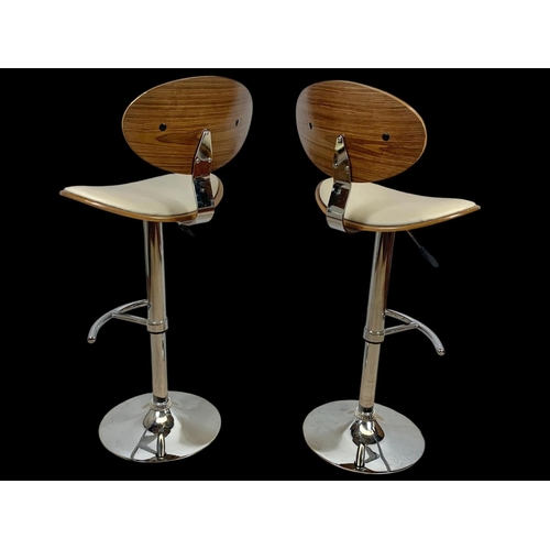 824 - A pair of Charles Eames style high stools. Ground to back 113.5cm.