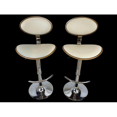 824 - A pair of Charles Eames style high stools. Ground to back 113.5cm.