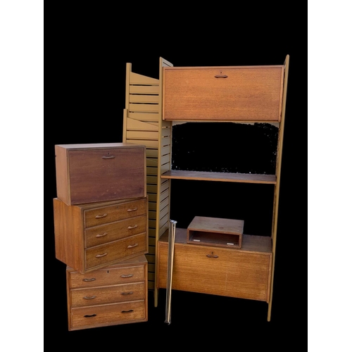 828 - A teak Ladderax shelving system.