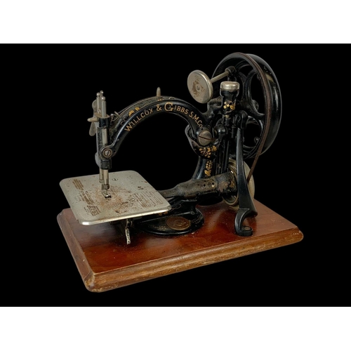 83 - A 19th century Willcox & Gibbs S.M. Co sewing machine. 33cm.