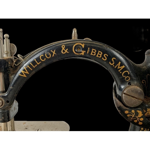 83 - A 19th century Willcox & Gibbs S.M. Co sewing machine. 33cm.