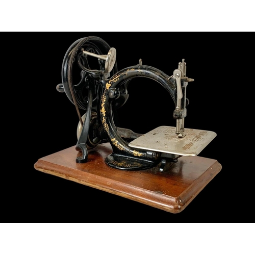 83 - A 19th century Willcox & Gibbs S.M. Co sewing machine. 33cm.