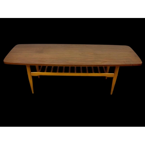 842 - A walnut and beech coffee table with under storage. Mid century. Circa 1960. 137 x 50 x 46cm.