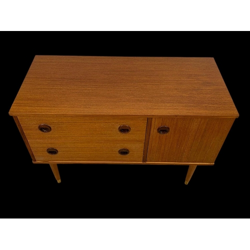 845 - A small teak sideboard with 2 drawers and cupboard. Circa 1970. 91.5 x 42.5 x 62.5cm