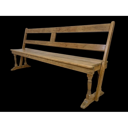 853 - A late 19th century pine reversible railway bench. 183cm.