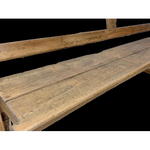 853 - A late 19th century pine reversible railway bench. 183cm.