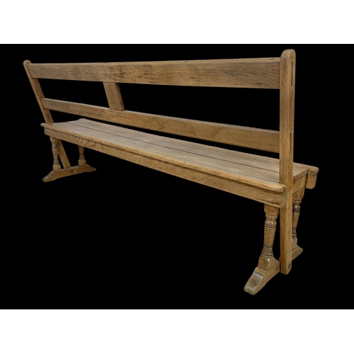 853 - A late 19th century pine reversible railway bench. 183cm.