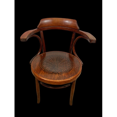 859 - A vintage bentwood armchair. 64 x 50 x 78cm.