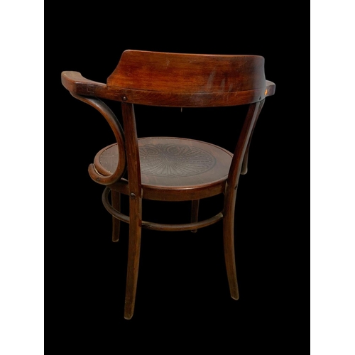 859 - A vintage bentwood armchair. 64 x 50 x 78cm.