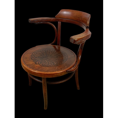 859 - A vintage bentwood armchair. 64 x 50 x 78cm.