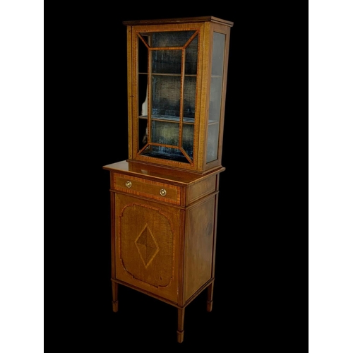 861 - An Edwardian inlaid display cabinet. With original blue velvet interior. 53 x 39.5 x 161cm.