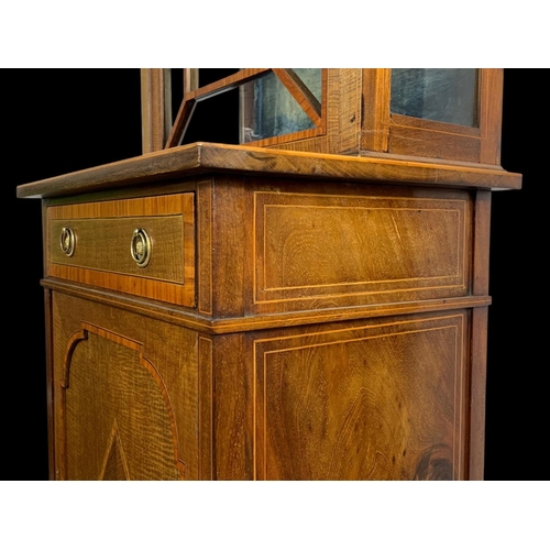 861 - An Edwardian inlaid display cabinet. With original blue velvet interior. 53 x 39.5 x 161cm.