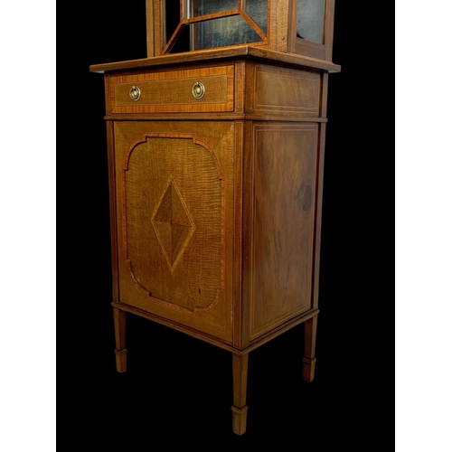 861 - An Edwardian inlaid display cabinet. With original blue velvet interior. 53 x 39.5 x 161cm.