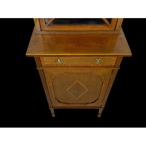 861 - An Edwardian inlaid display cabinet. With original blue velvet interior. 53 x 39.5 x 161cm.