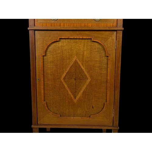 861 - An Edwardian inlaid display cabinet. With original blue velvet interior. 53 x 39.5 x 161cm.