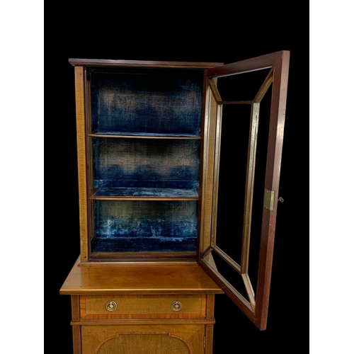 861 - An Edwardian inlaid display cabinet. With original blue velvet interior. 53 x 39.5 x 161cm.