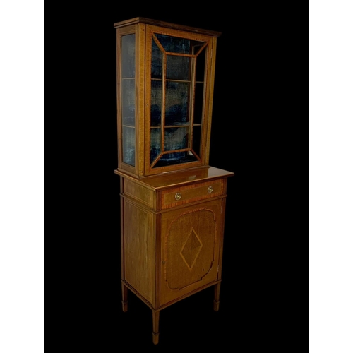 861 - An Edwardian inlaid display cabinet. With original blue velvet interior. 53 x 39.5 x 161cm.