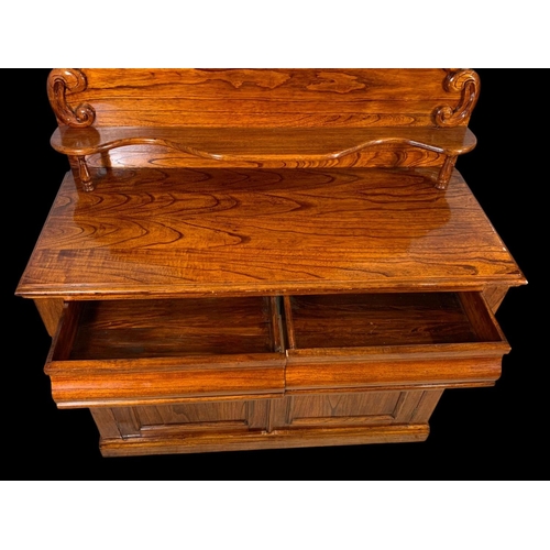 863 - A Victorian style elm chiffonier. With craved gallery, 2 drawers and a 2 drawer cupboard. 122 x 52 x... 