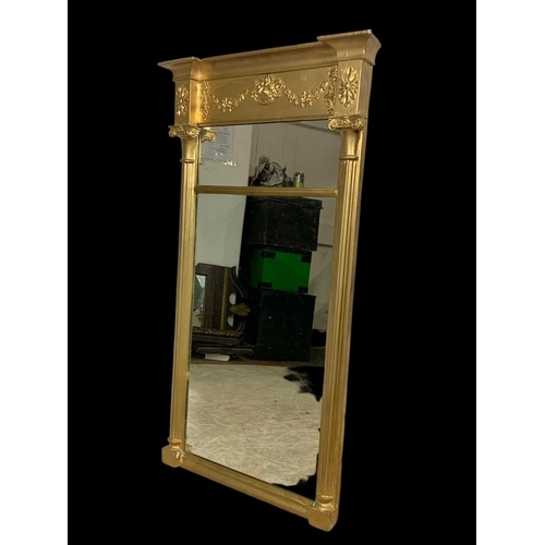 864 - An early 19th century Regency gilt framed mirror. 56.5 x 101cm.