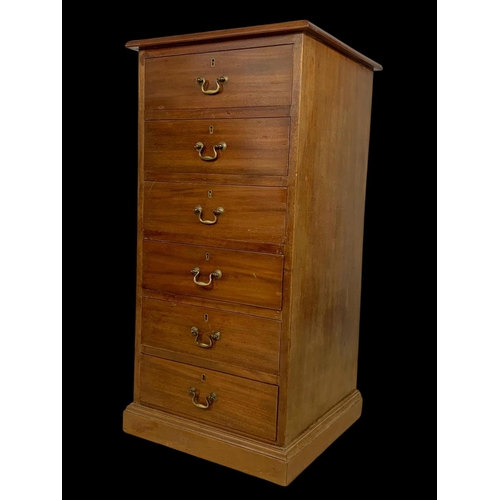 865 - A tall Edwardian mahogany office chest of drawers with brass drop handles. Stamped O’Connell Cork. 5... 