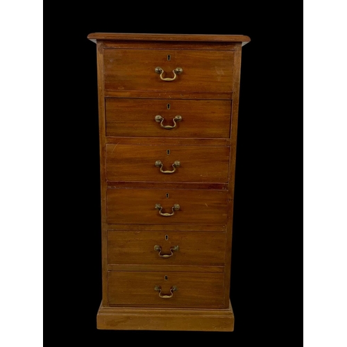 865 - A tall Edwardian mahogany office chest of drawers with brass drop handles. Stamped O’Connell Cork. 5... 