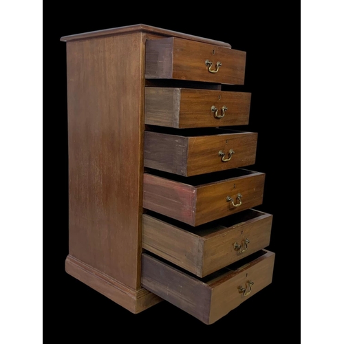 865 - A tall Edwardian mahogany office chest of drawers with brass drop handles. Stamped O’Connell Cork. 5... 