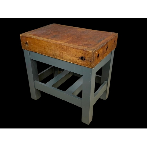 873 - A large butcher block on stand. 91.5 x 62 x 90.5cm